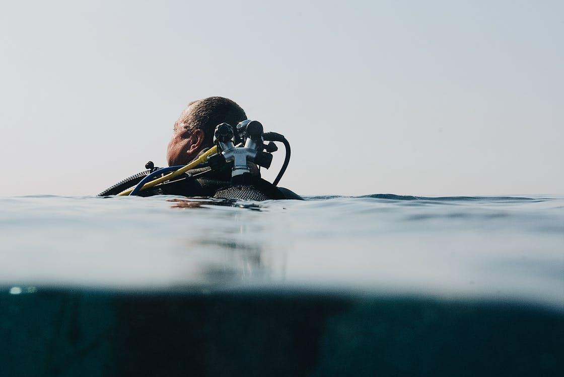 A scuba diver on the water surface