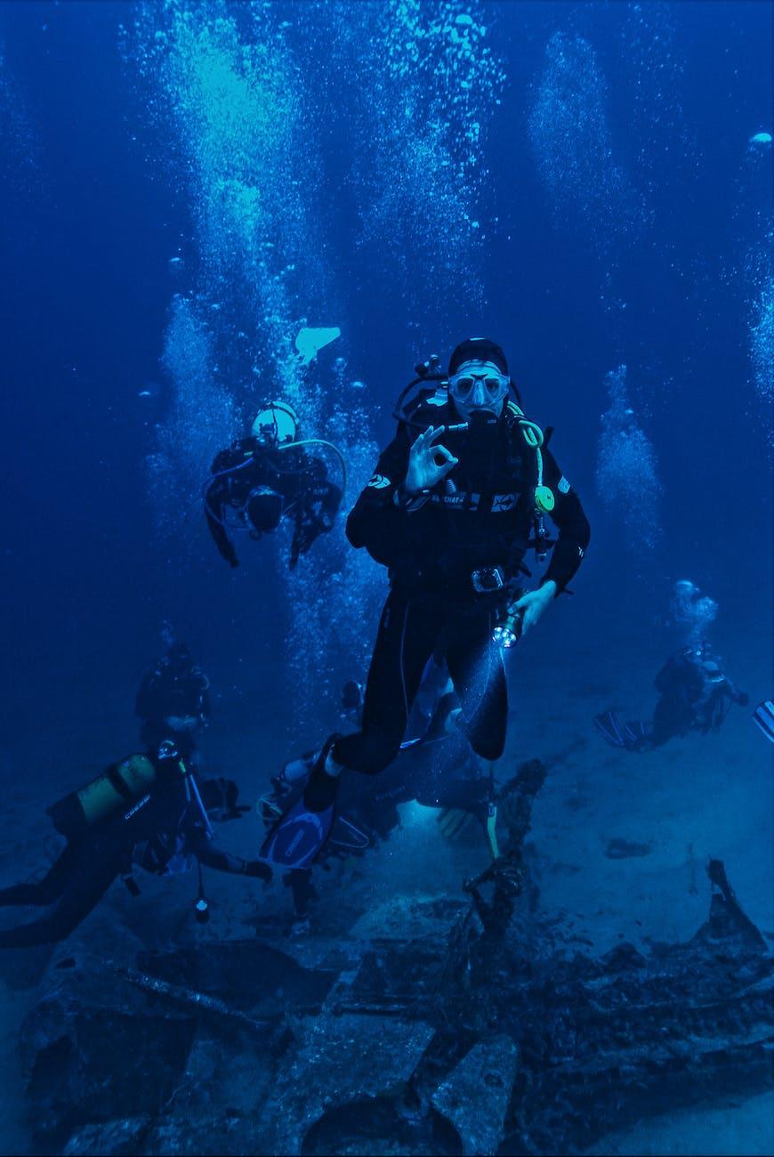 Scuba divers exploring an underwater wreck site